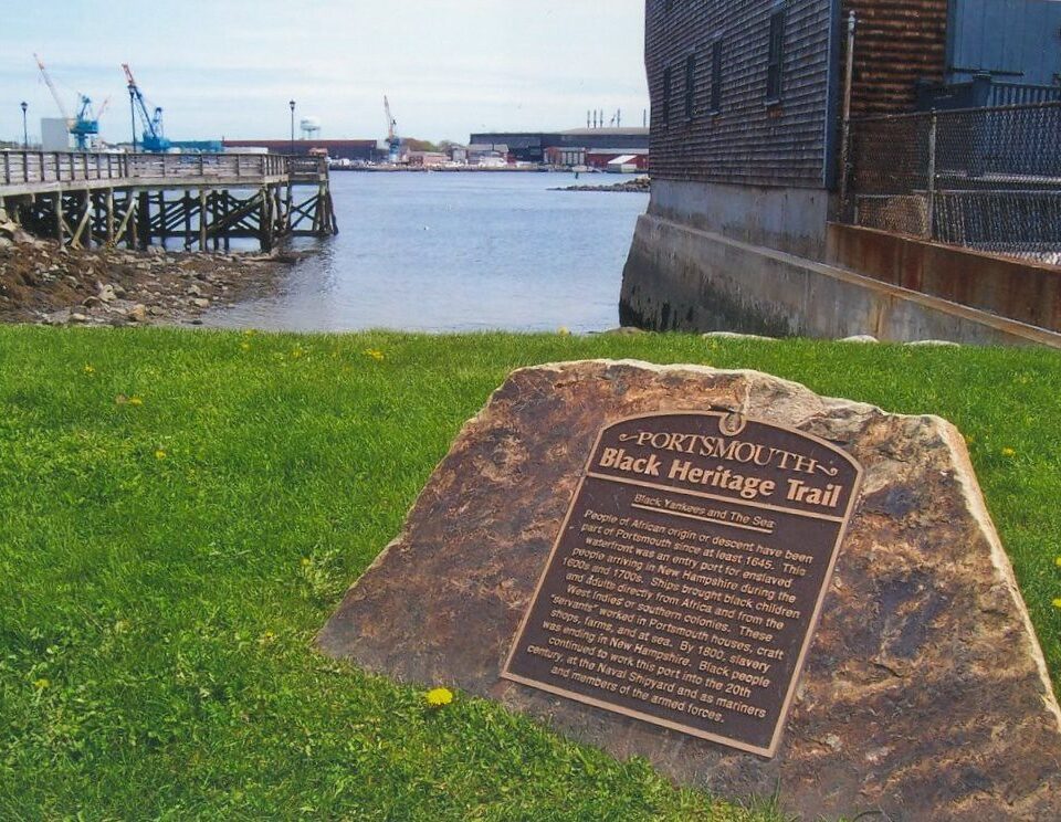 a commemorative plaque with writing about the Atlantic slave trade