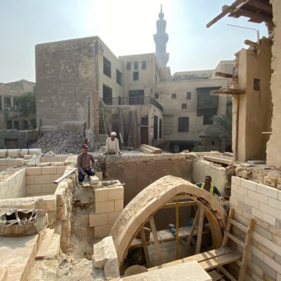 building work with a stone arch on the site of Bayt al Razzaz, Cairo