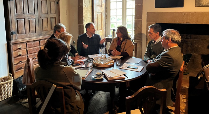 People sitting around a table discussing