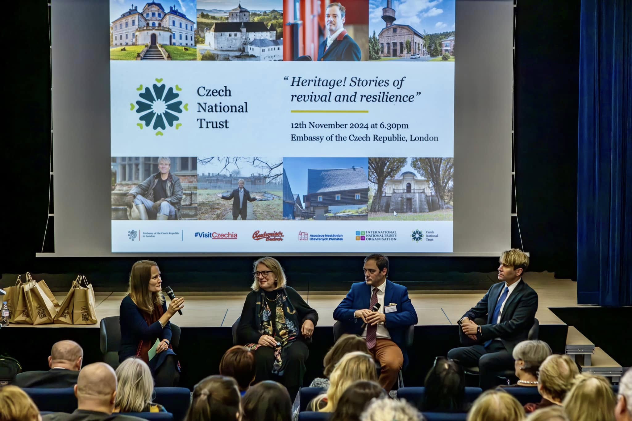 People on stage during a seminar