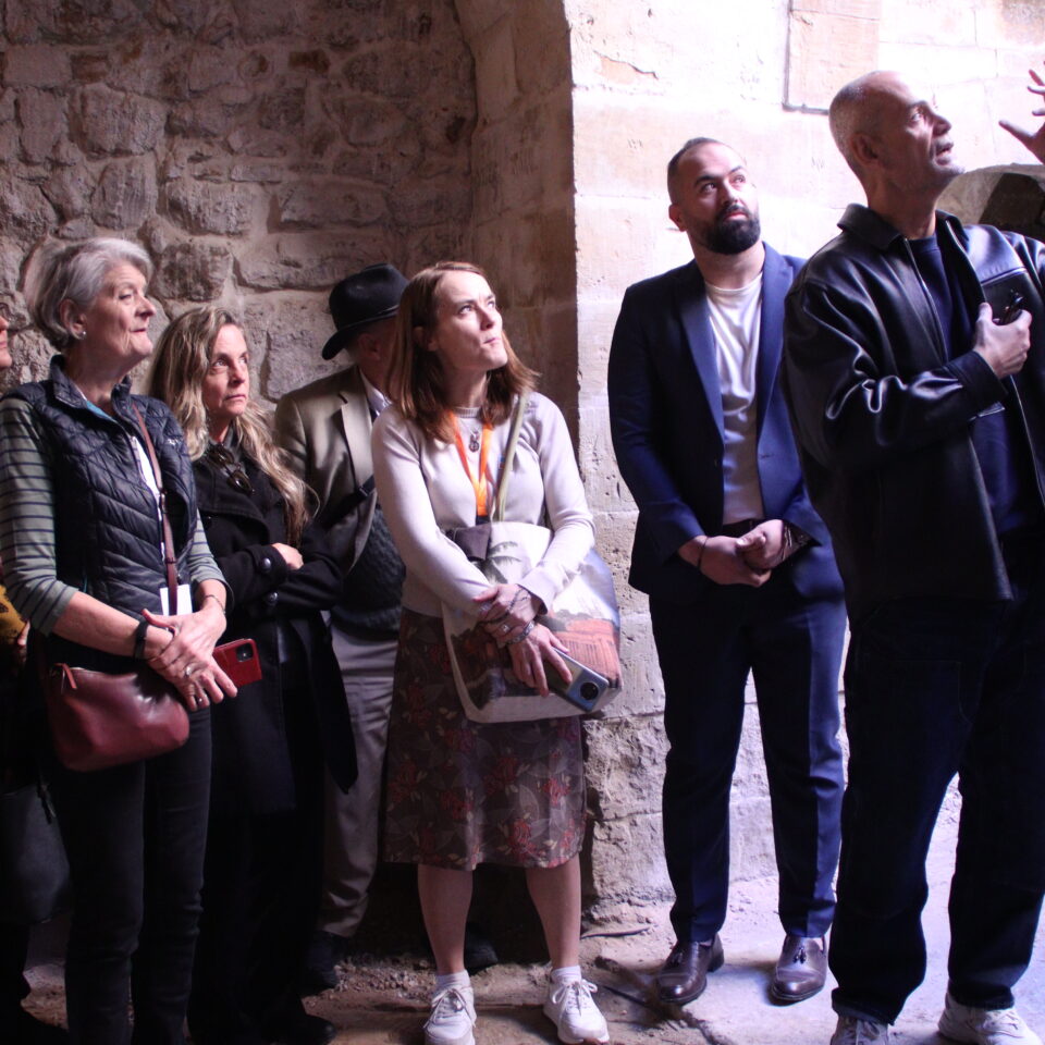 Architect Sahel AlHiyari gives National Trust colleagues and other INTO members a guided tour of Bayt al-Jaghbeer, during the 'Facing Change' conference in December 2024.