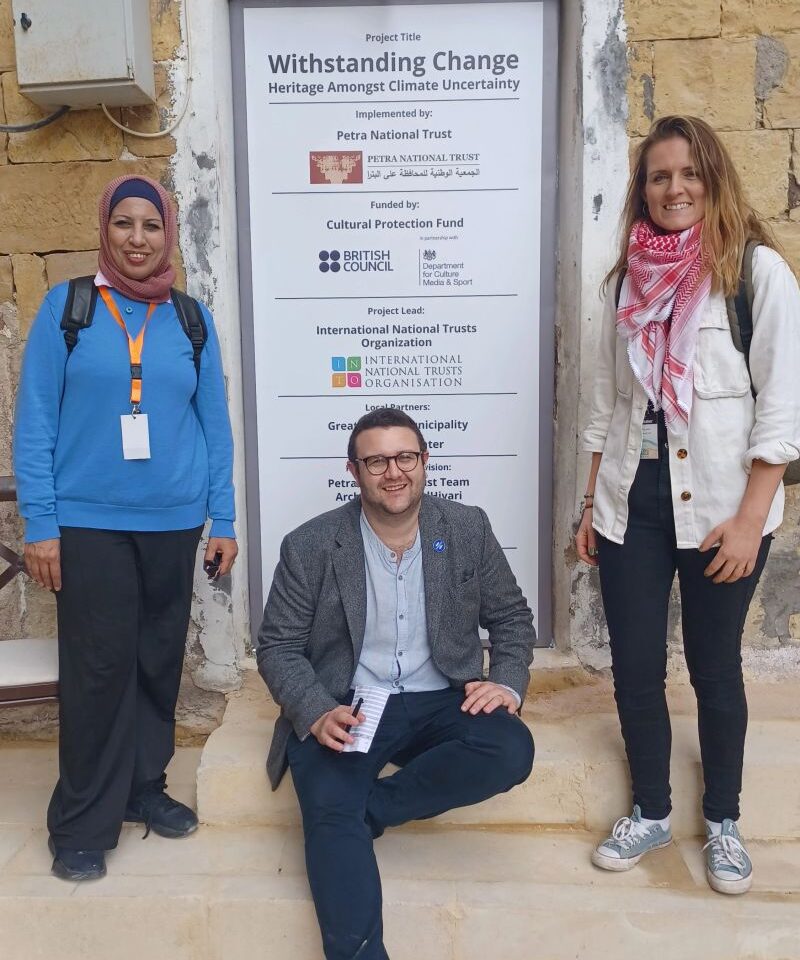 Huda Amarin of Petra National Trust, with Alex Lamont Bishop of INTO and Katy Lamb of the National Trust (England, Wales and Northern Ireland), outside Bayt al-Jaghbeer